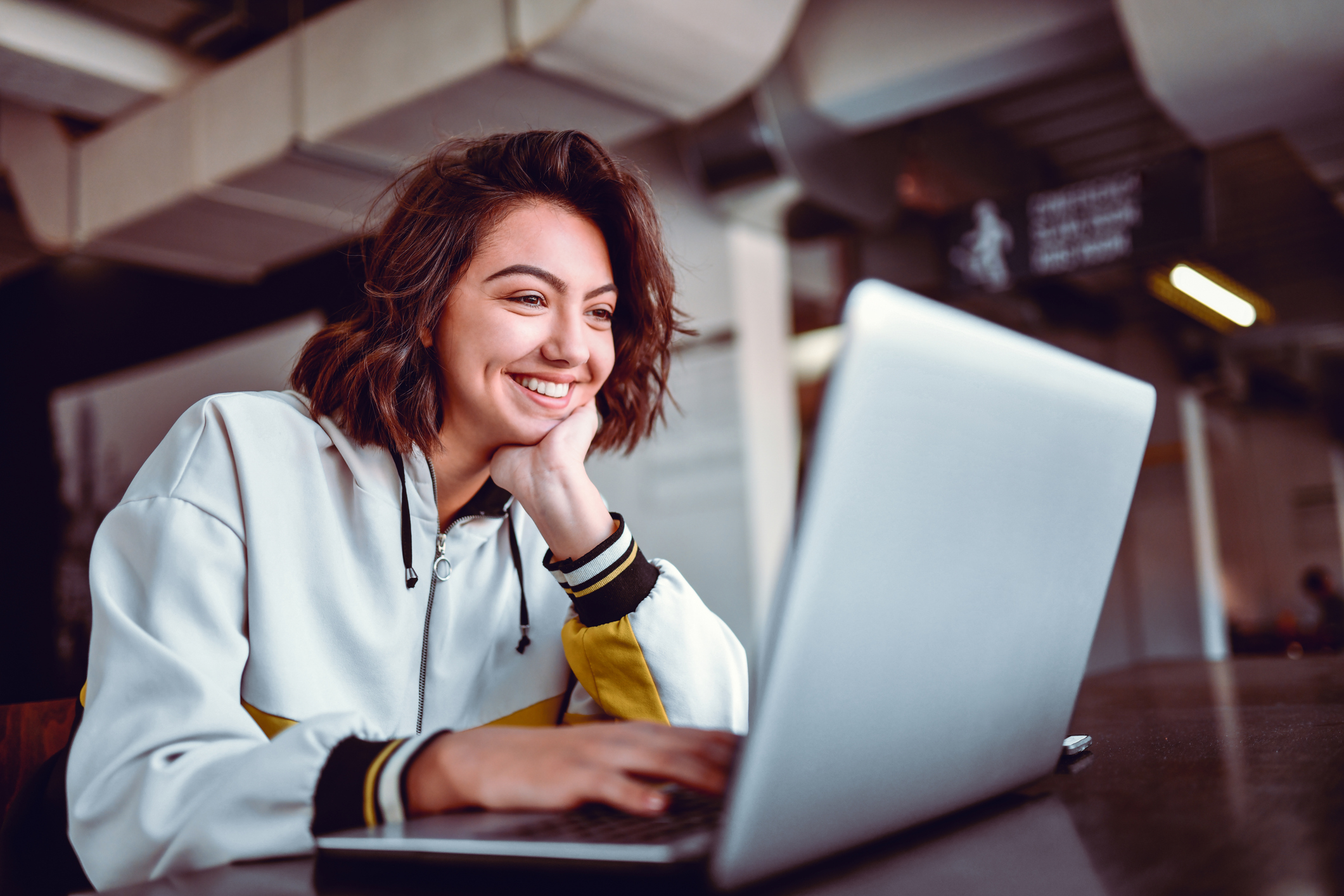 Hispanic Female Studying On Laptop